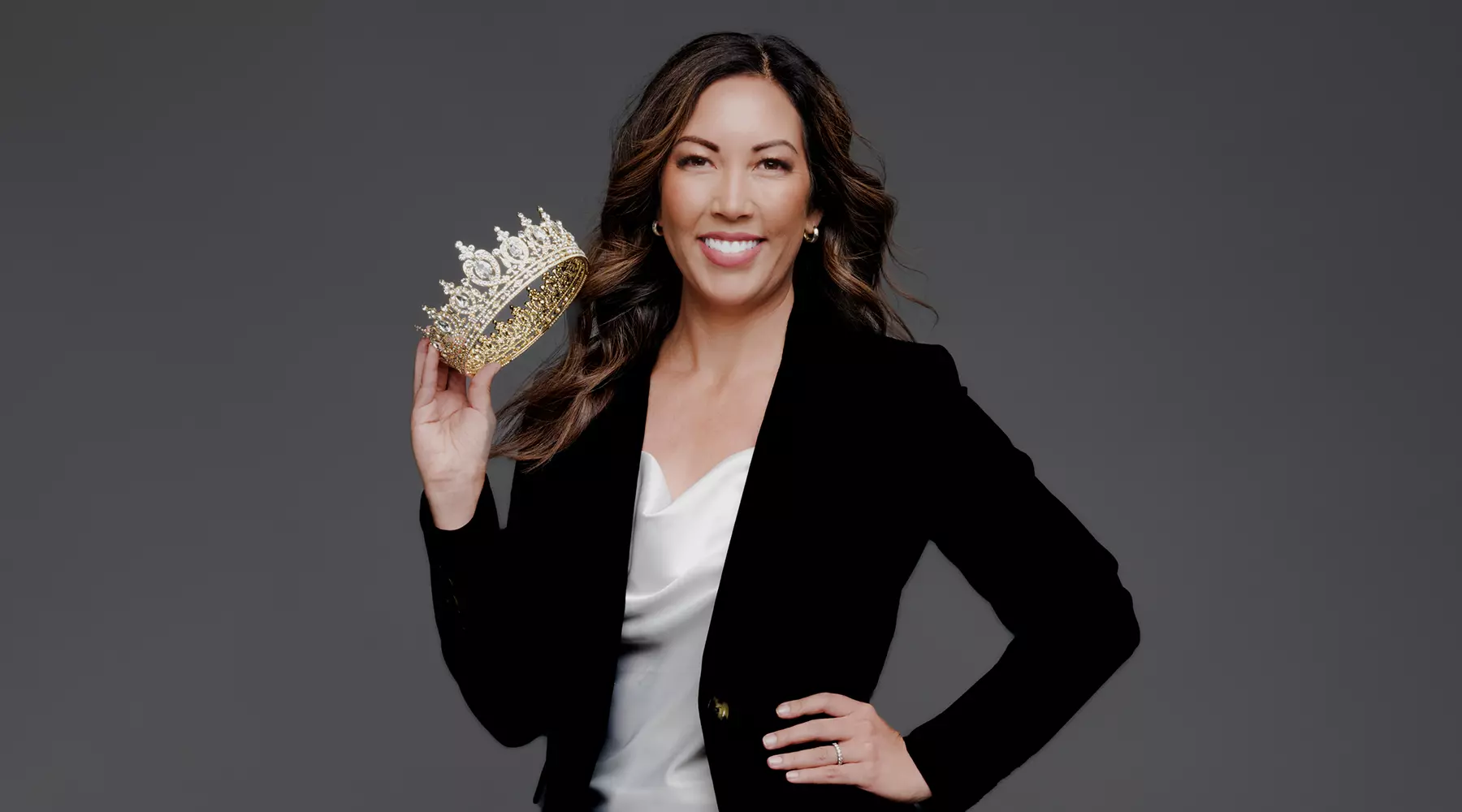 Dr. Kristin Kratzer Holding a Crown